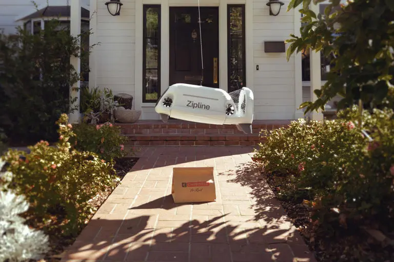 Flytrex Sky2 octocopter drone in flight carrying a food delivery order